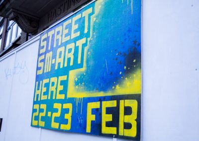 Photo of spray painted poster advertising Streetsmart on 22 and 23 Feb at the Observer Building